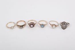 Five 9ct gold dress rings and a silver ring.