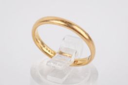 A 22ct gold wedding band. Of slender, convex form, hallmarked, size L, weight 2.88g.
