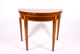 A late Georgian mahogany demi-lune fold over card table.