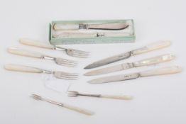 A small group of silver and silverplated mother of pearl handled cutlery.