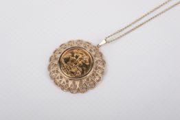 A 1982 half sovereign coin in a yellow metal mount and chain. The pierced mount circa 3.