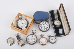 An assortment of pocket watches and wristwatches.