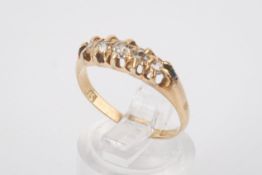 An 18ct gold and diamond ring. Set with five old cut diamonds of circa 0.