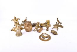 A group of vintage brass collectables including a vesta and ink pot.