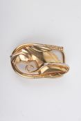 A gold plated 'horse head' belt buckle.