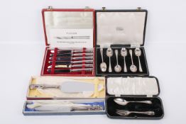 A five boxed pieces of silver flatware.