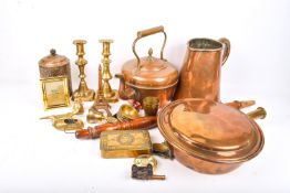 A collection of assorted copper and brassware. Including warming pan, kettle and jug, etc.