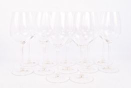 A set of twelve Riedel Restaurant Poppy Sauvignon Blanc wine glasses.