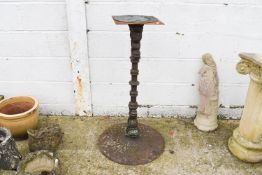 A cast metal garden stand with sun dial.