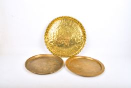 Three brass Far Eastern style round trays.