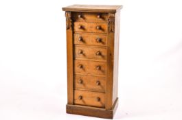 An oak wellington chest of drawers.