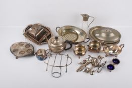 A collection of silverplated table items. Including serving dishes, pots, a little cutlery, etc.