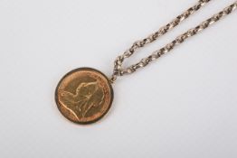 A full sovereign in a hallmarked 9ct gold mount with chain.
