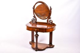 A 20th century mahogany veneered dressing table.