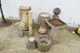 A large quantity of reconstituted stone garden ornaments. Including a bird bath, finial, etc.