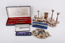 A box of silverplated and other items.