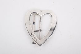 A Victorian silver belt buckle. Modelled as a heart, maker Lawrence Emanuel, Birmingham 1896, 36.0g.