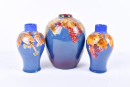 Three Royal Doulton vases.