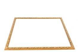 A large rectangular giltwood framed wall mirror.
