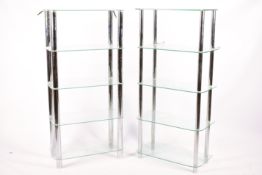 A pair of contemporary glass open shelving units.