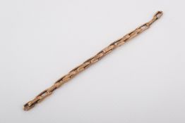 A vintage rose coloured metal extendable watch strap.