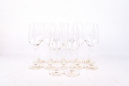 A set of twelve Riedel Restaurant Poppy Champagne glasses.