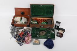 A box of assorted costume jewellery and two jewellery boxes.