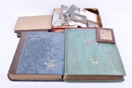 Five albums and some loose vintage postcards and photographs.