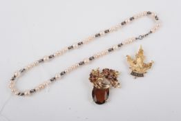 Three pieces of jewellery.