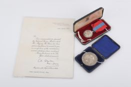 A named Imperial Service medal and a silver Plymouth Education Authority medallion.