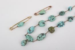 A 9ct rose gold and turquoise beaded necklace and two bar brooches.