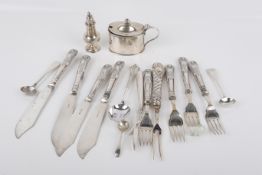A group of silver flatware and table items.