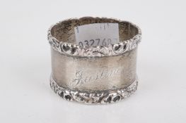 An Edwardian silver napkin ring.
