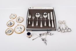 An assortment of silverplate and collectables.