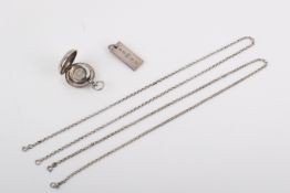 A silver ingot pendant, sovereign case and two chains. The pendant marked 'JSL', London 1977, 31.