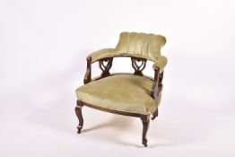 Victorian mahogany tub chair upholstered in sage green.