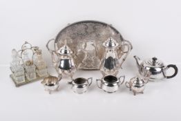 A box of assorted silverplated and other items.