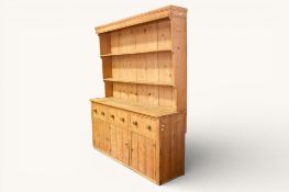 A large 20th century pine kitchen dresser.