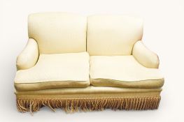 A traditional Howard style cream upholstered two seater sofa.