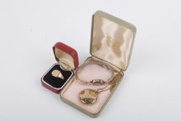 Three items of gold and yellow metal jewellery.