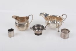 Five small pieces of silver and white metal.