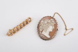 A gold plait brooch and a gold mounted cameo brooch. The first 4.8cm x 0.