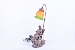 A contemporary Widdop L2397 table lamp modelled as a woman sewing.