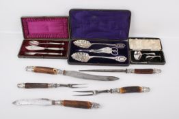 An assortment of silver plated and silver flatware.