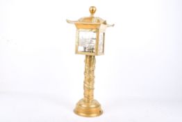 A brass Burmese pagoda style table lamp.