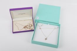 Four 9ct gold and yellow metal rings and two necklaces.