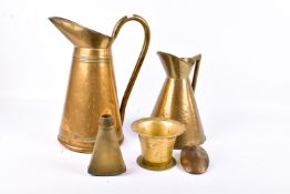 An assortment of 19th century and later metalware. Including two brass tapered jugs, a mortar, etc.
