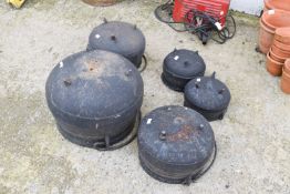 Five cast metal 'witches' cauldrons.
