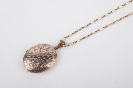 A 9ct gold chain with gold plated oval picture locket.