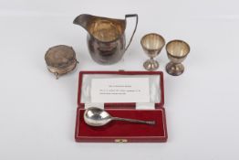 An assortment of silver and white metal.